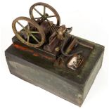 A GEORGES CARETTE MODEL GAS ENGINE, WITH TWO FLYWHEELS, OF CAST IRON AND BRASS, PAINTED BLACK, LINED