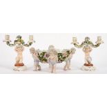 A PAIR OF JOHN BEVINGTON FLORAL ENCRUSTED CANDELABRA, SUPPORTED BY A KNEELING CHILD, 22CM H,
