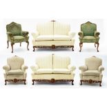 A CARVED WALNUT SIX PIECE SUITE, INCLUDING A PAIR OF SOFAS AND TWO PAIRS OF CHAIRS