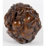 A JAPANESE CARVED HARDWOOD BALL NETSUKE OF ANIMALS, 5CM D