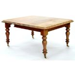 A VICTORIAN MAHOGANY EXTENDING DINING TABLE ON BALUSTER LEGS AND POTTERY CASTORS, WITH ONE LEAF,