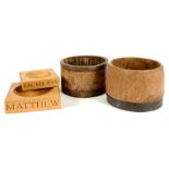 TWO IRON BOUND WOODEN CAPACITY MEASURES AND TWO SIMILAR GRADUATED OAK STANDS OR ASH TRAYS, CARVED