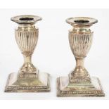 A PAIR OF VICTORIAN SILVER DWARF CANDLESTICKS, 11 CM H, LOADED, SHEFFIELD 1900++TARNISHED. BUILD