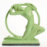 AN ART DECO GREEN PAINTED PLASTER SCULPTURE OF A HOOP GIRL, 29CM H, MOULDED NUMBERS, INCLUDING RD