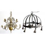 A VICTORIAN BRASS TWELVE BRANCH CHANDELIER AND A WROUGHT IRON CHANDELIER