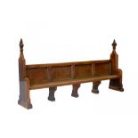 A VICTORIAN GOTHIC OAK BENCH, C1856-1878 with carved poppy-heads, 144cm h; 50 x 287cmProvenance: