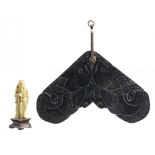 A CHINESE OBSIDIAN HANGING CHIME, QING DYNASTY finely carved to both sides in shallow relief with