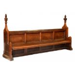 A VICTORIAN GOTHIC OAK BENCH, C1856-1878 with carved poppy heads to the ends, 153cm h; 67 x