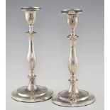 A PAIR OF GEORGE III NEO CLASSICAL SILVER CANDLESTICKS reeded nozzles, 29cm h, by John Green,