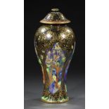 A WEDGWOOD FAIRYLAND LUSTRE VASE AND COVER DESIGNED BY DAISY MAKEIG-JONES, C1920 decorated with