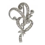 AN OLD CUT DIAMOND BROOCH of scrolling design, the diamonds approx 0.75 ct, in platinum, velvet