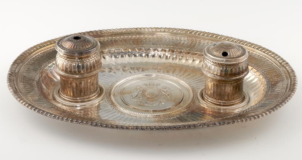 A GADROONED AND FLUTED OVAL SILVER INKSTAND with let in royal arms medallic centre flanked by