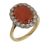 A FIRE OPAL RING with brilliant cut diamond surround, in gold marked 18ct, 6.5g, size P ++Fire