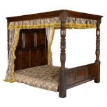 AN OAK FOUR POSTER BED, early 17th c style the moulded tester with channelled rails, panelled head