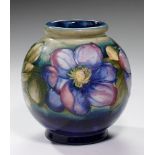 A MOORCROFT GLOBULAR CLEMATIS VASE, C1953-60 14.5cm h, impressed marks, painted signature, paper