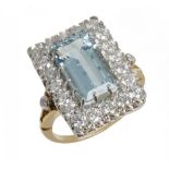 AN AQUAMARINE AND DIAMOND CLUSTER RING the step cut aquamarine approx 3.5 ct, the brilliant cut