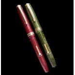TWO CONWAY STEWART FOUNTAIN PENS, 58 AND 76 green and red herringbone respectively++As found