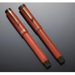 TWO PARKER BIG RED FOUNTAIN PENS, DUOFOLD one inscribed SIR MALCOLM WATSON++Both in as found