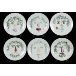 †PIERO FORNASETTI. A SET OF SIX PORCELAIN ARCIMBOLDESCA PLATES, C1955 24cm diam, Winterling Barvaria