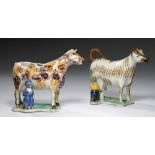 TWO PRATT WARE COW CREAMERS WITH MILKMAIDS, C1810 each on shaped flat green base, one decorated in