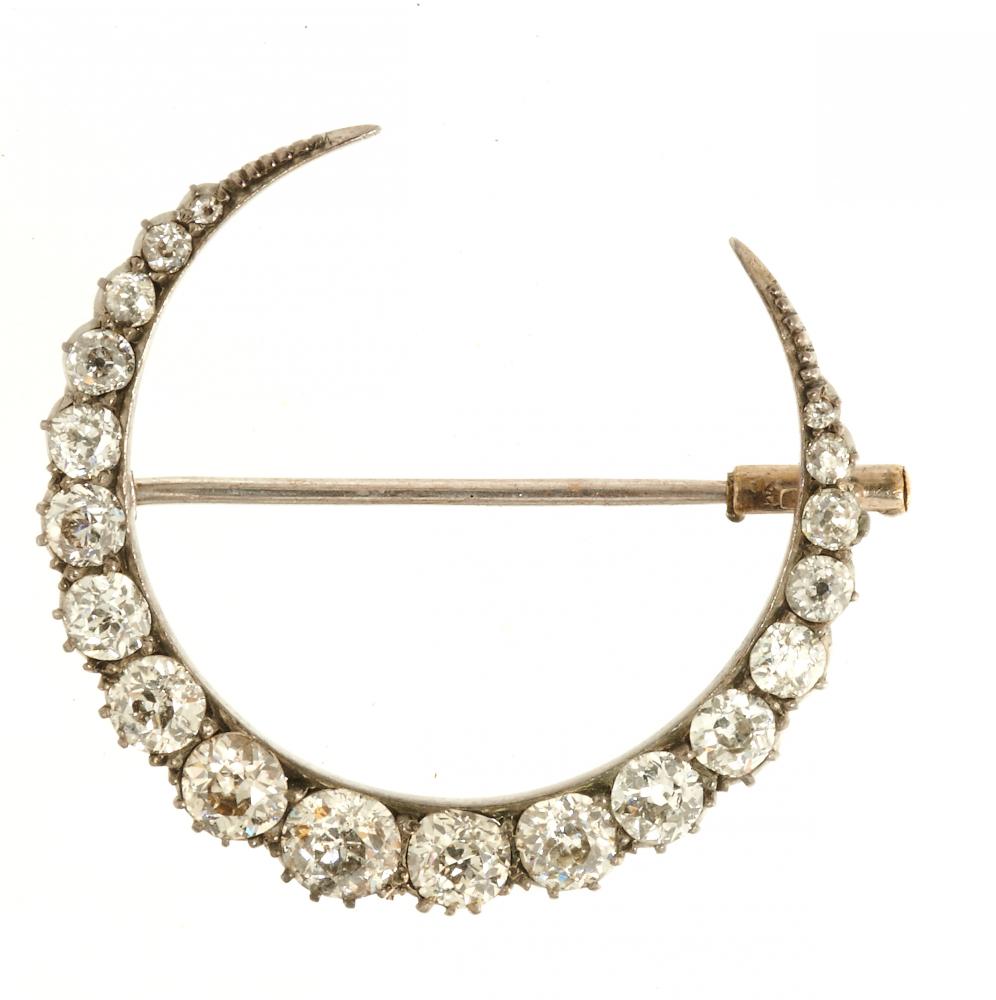 A VICTORIAN DIAMOND CRESCENT BROOCH, C1880 the old cut diamonds approx 2.1 ct, in gold, 3.3 x 2.8