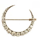 A VICTORIAN DIAMOND CRESCENT BROOCH, C1880 the old cut diamonds approx 2.1 ct, in gold, 3.3 x 2.8