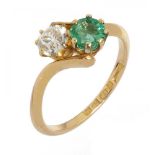 AN EMERALD AND OLD CUT DIAMOND TWIST RING the diamond approx 0.5 ct, emerald approx 0.6 ct, in