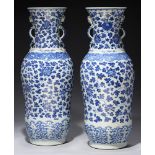 A PAIR OF CHINESE BLUE AND WHITE DOUBLE BALUSTER VASES, QING DYNASTY, 18TH/19TH C the flared neck