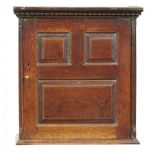 AN ENGLISH JOINED OAK MURAL CUPBOARD, HEREFORDSHIRE/WELSH MARCHES, FIRST HALF 18TH C with