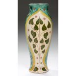 A DELLA ROBBIA IRIS VASE DECORATED BY VIOLET WOODHOUSE, C1900 covered in cream slip and incised with