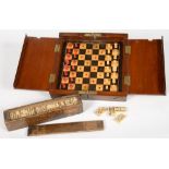 A VICTORIAN MAHOGANY FOLDING MINIATURE BONE CHESS SET AND A CASED SET OF BONE DOMINOES