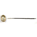 A SILVER AND TWISTED BALEEN HANDLED TODDY LADLE, 37 CM L, INSET WITH A PORTUGUESE ½ ESCUDO 1778 GOLD