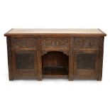 AN ANTIQUE CARVED OAK SIDEBOARD WITH PANELLED DOORS AND BOARDED TOP, ELEMENTS 17TH C, 79CM H; 160