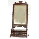 A REGENCY MAHOGANY DRESSING MIRROR ON SERPENTINE BASE, FITTED WITH SIX DRAWERS, 75CM H; 36 X 23CM