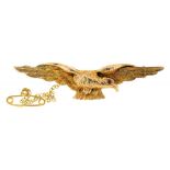 A GOLD EAGLE BROOCH, WITH GARNET EYE, MARKED 9CT, 8G++GENERAL WEAR CONSISTENT WITH AGE