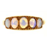 A FIVE STONE OPAL RING, IN GOLD MARKED 18CT, 2.5G, SIZE N½ AND A BROWN STAR SAPPHIRE RING, IN 9CT