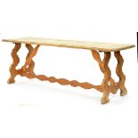 A PINE REFECTORY TABLE WITH BOARDED TOP ON STRETCHER BASE, EARLY 20TH C, 79CM H; 220 X 67CM