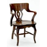 AN ARTS AND CRAFTS OAK ELBOW CHAIR, EARLY 20TH C