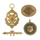 A VICTORIAN 9CT GOLD HORSESHOE BAR BROOCH, BIRMINGHAM 1888, A MONGRAMMED GOLD BROOCH, A GOLD AND