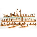 A COLLECTION OF FIFTY TWO NIGERIAN THORN-WOOD MINIATURE CARVINGS OF MAINLY SINGLE ARTISANS, CRAFTS