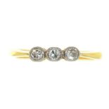 A THREE STONE DIAMOND RING, RUBOVER SET IN GOLD MARKED 18CT, SIZE O, 2.5G++LIGHT WEAR CONSISTENT