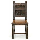 A NORTH EUROPEAN CARVED OAK HALL CHAIR WITH PANELLED BACK AND BOARDED SEAT