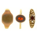 THREE GOLD RINGS, TWO SET WITH GARNETS, MARKED 9CT, SIZES N - T, 7G++LIGHT WEAR CONSISTENT WITH AGE