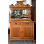 AN ART NOUVEAU STYLE OAK MIRROR BACKED SIDEBOARD WITH BEVELLED PLATE, ON BUN FEET, 188CM H; 120 X