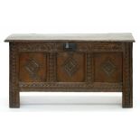 A GEORGE III CARVED OAK CHEST WITH PANELLED FRONT, THE INTERIOR WITH A TILL, 57CM H; 108 X 36CM