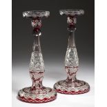 A PAIR OF RUBY FLASHED, ENGRAVED AND CUT GLASS CANDLESTICKS, EARLY 20TH C, 33CM H++Good condition