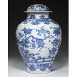 A CHINESE BLUE AND WHITE JAR AND COVER, QING DYNASTY, 19TH C, painted with landscape and fence, 33cm