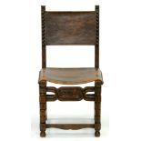 A SPANISH CARVED OAK CHAIR, WITH NAILED LEATHER BACK AND SEAT