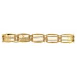 A GOLD GATE BRACELET, MARKED 9CT, 17.5G++SOME DENTS AND TWO LINKS SPLIT