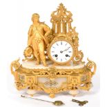 A FRENCH SPELTER GILT AND ALABASTER MANTEL CLOCK, THE DRUM CASED MOVEMENT STRIKING ON A BELL, 33CM